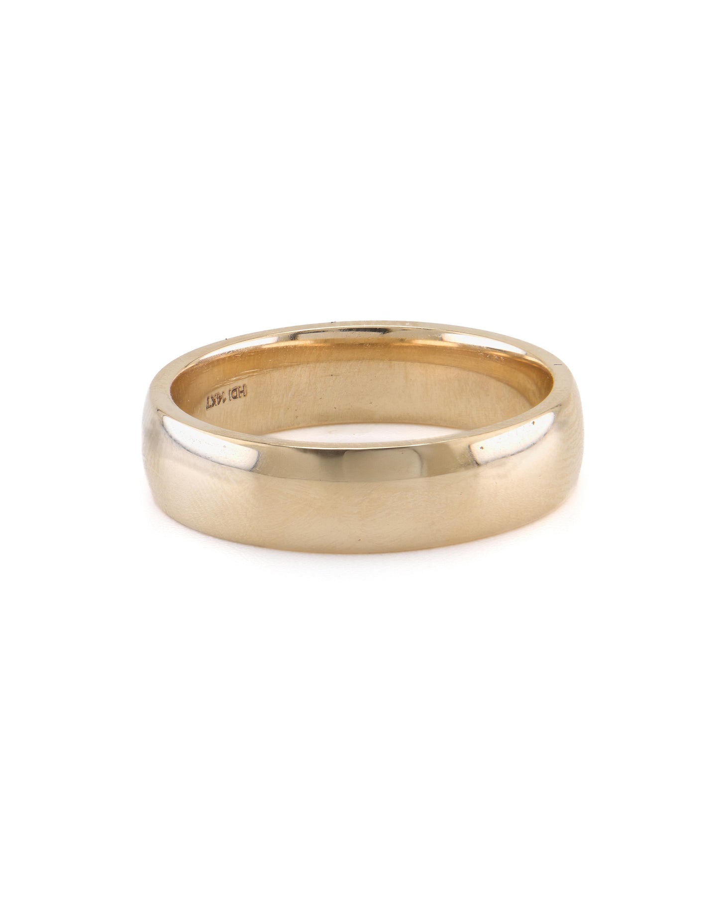 A polished, 18K yellow gold wedding band with a plain design.
