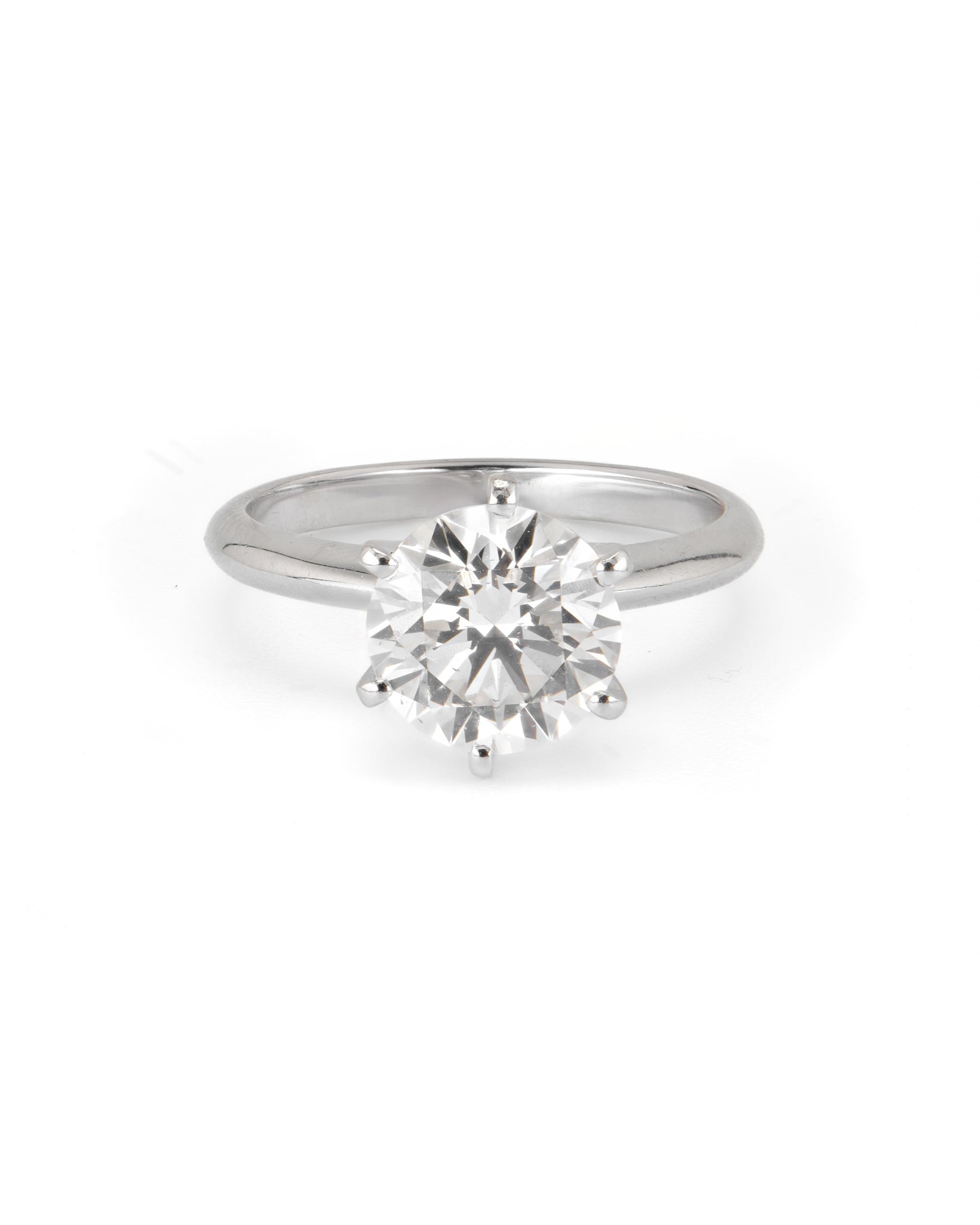 A round solitaire engagement ring with a 2.40 CT natural diamond, set in a 6-prong setting, on a white background.