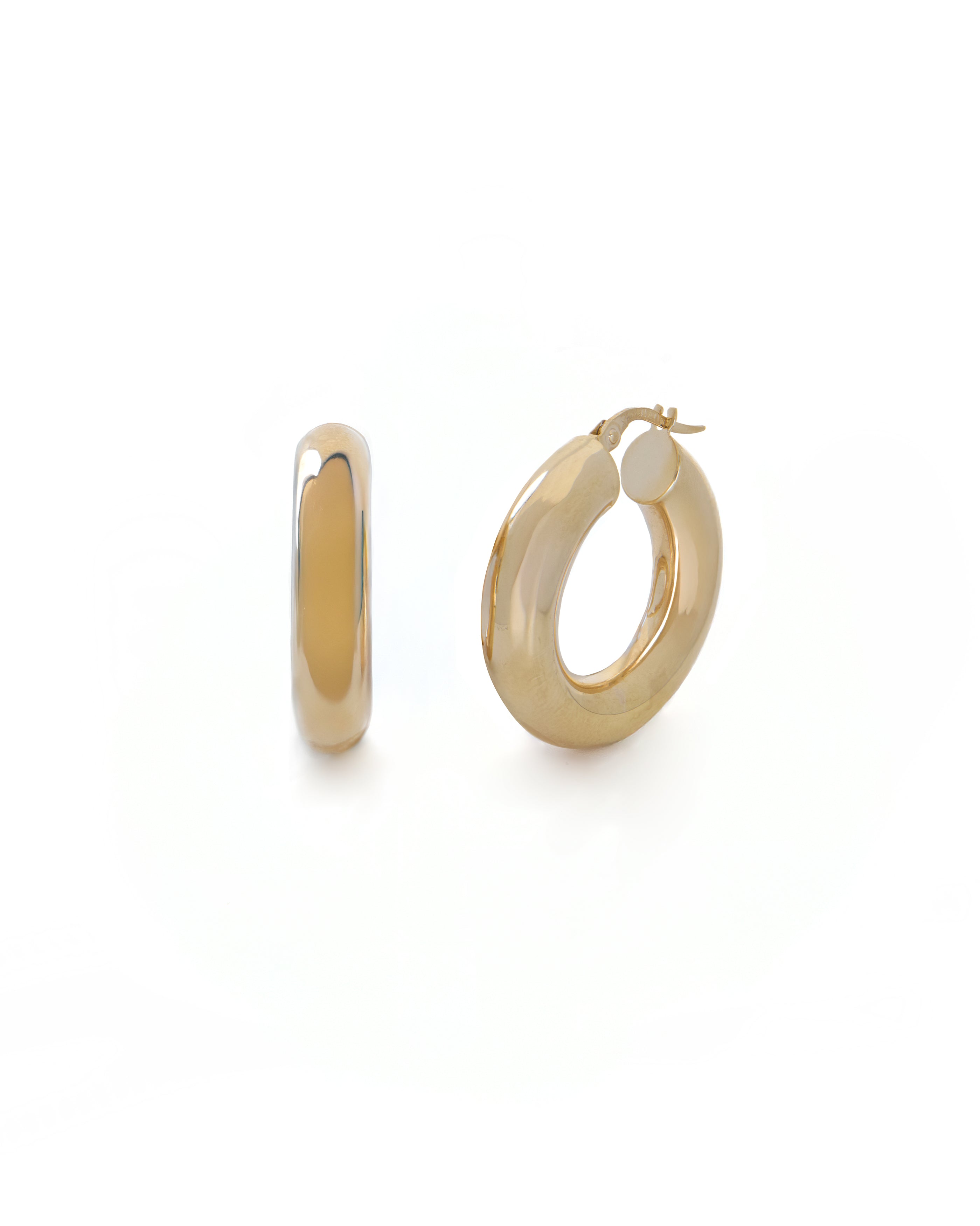 Gold hoop earrings on a white background