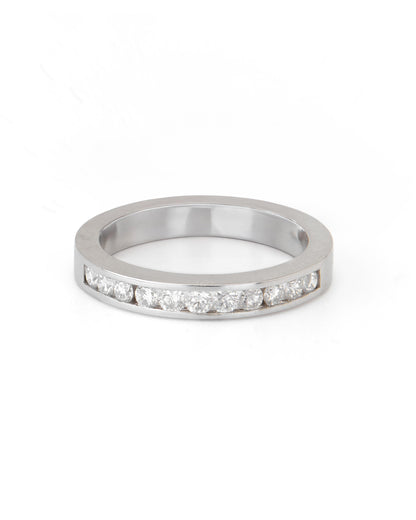 A channel set diamond band ring with multiple stones, displayed against a white background.