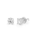 Pair of diamond stud earrings on a white background