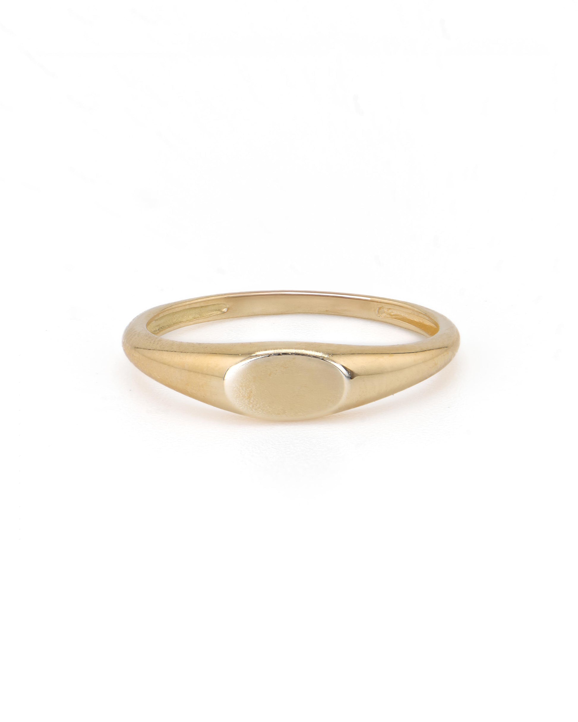 A 14K yellow gold signet ring with a plain band and a customizable engraving surface.
