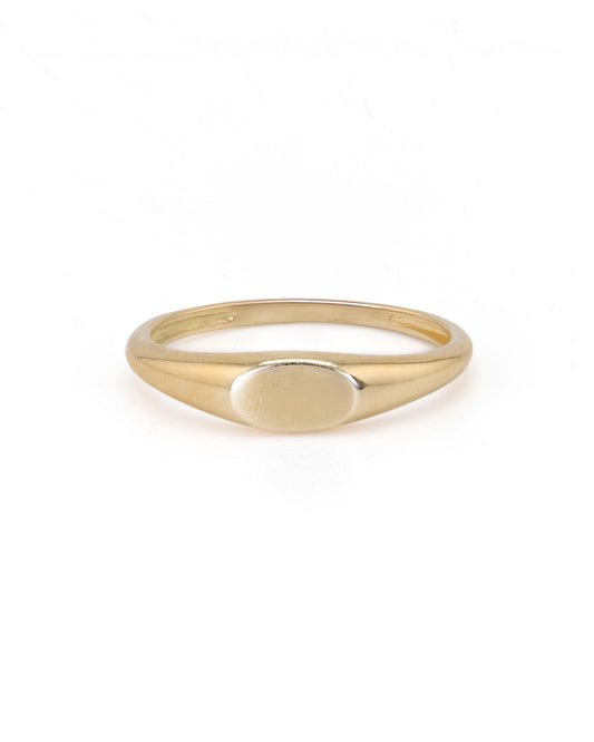 A 14K yellow gold signet ring with a plain band and a customizable engraving surface.