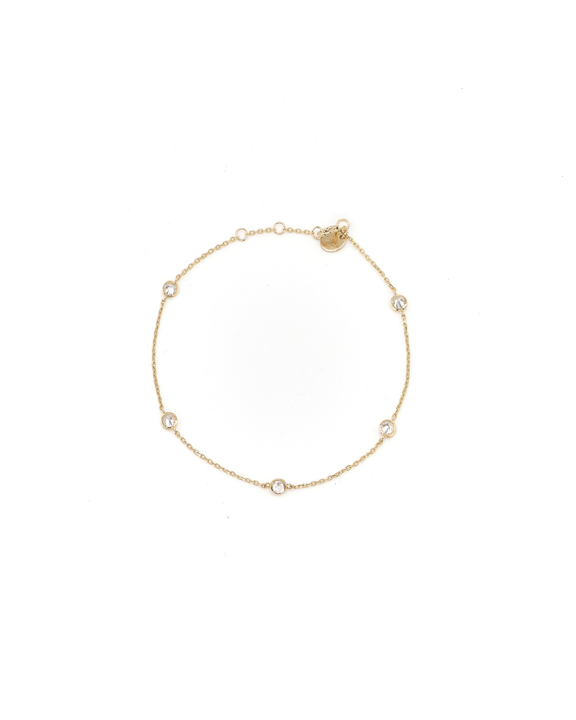 Gold bracelet with small diamonds on a white background
