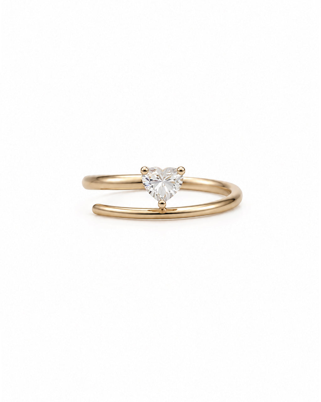 A 14k gold open band ring featuring a small, heart-shaped diamond in the center, set against a plain white background.