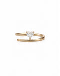 A 14k gold open band ring featuring a small, heart-shaped diamond in the center, set against a plain white background.