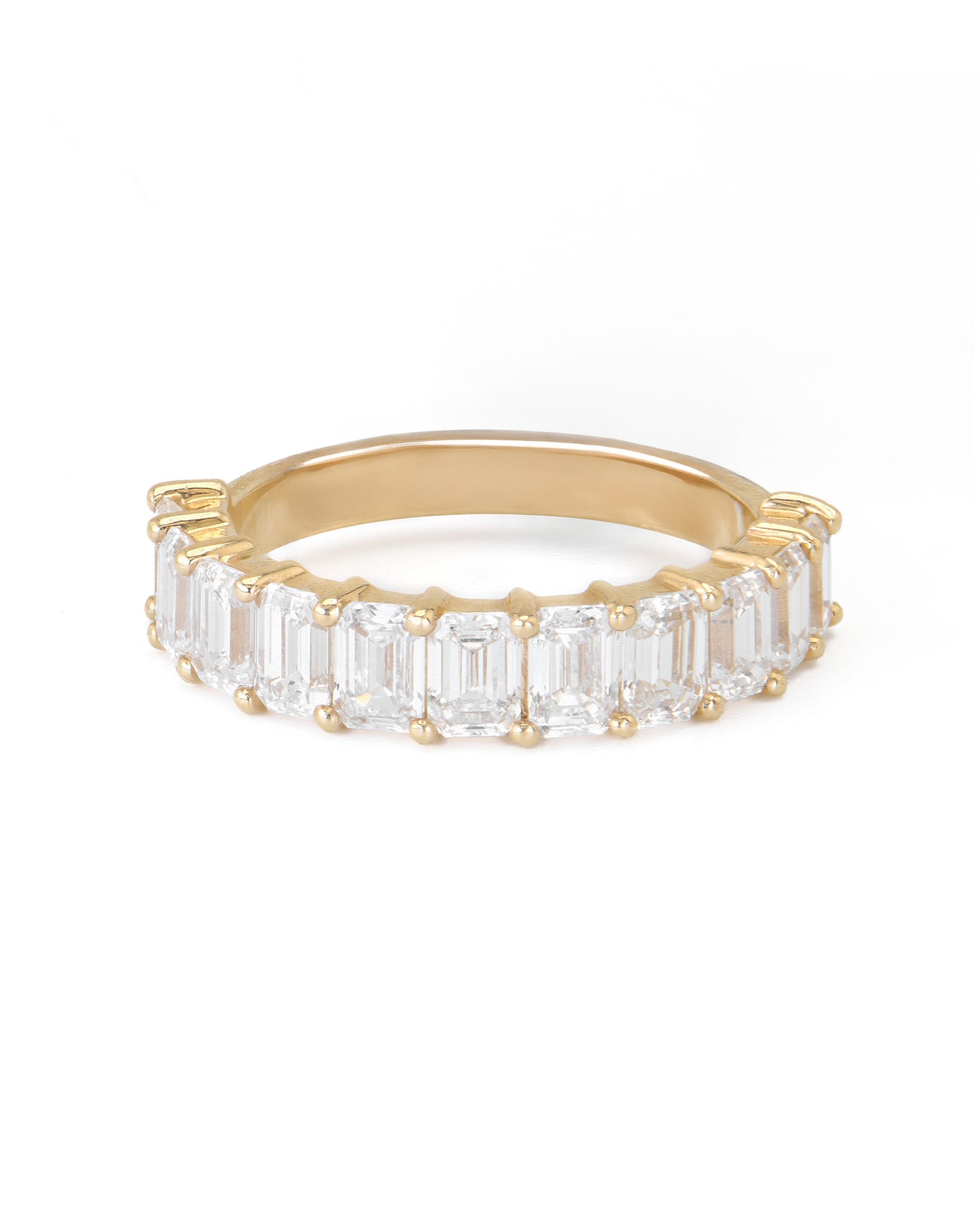A gold band featuring a series of emerald cut diamonds set closely together.