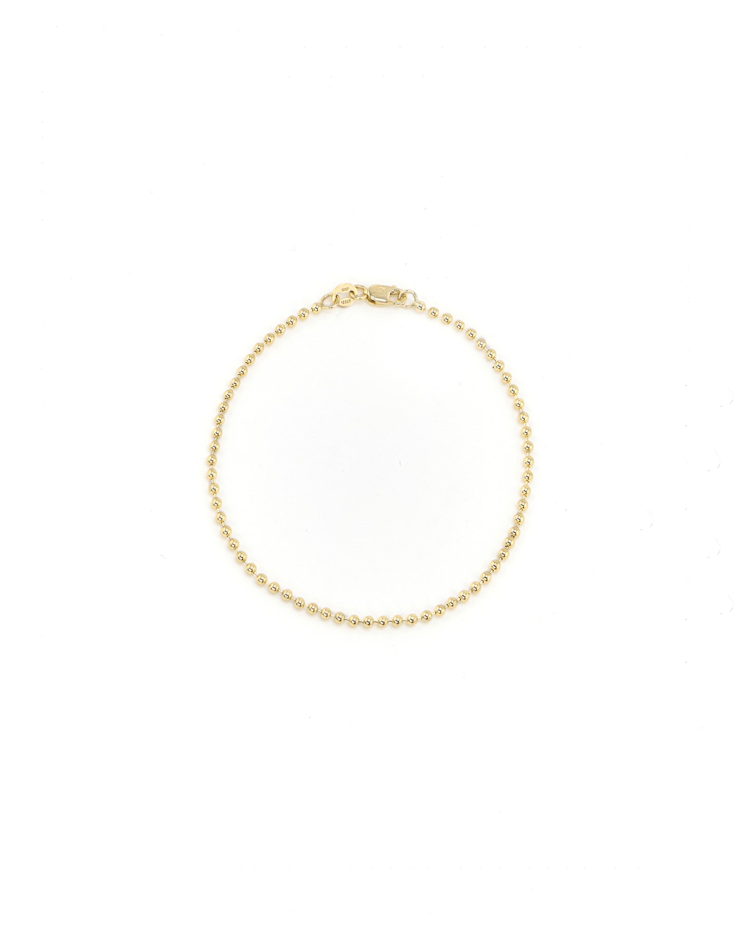 Gold bracelet on a white background