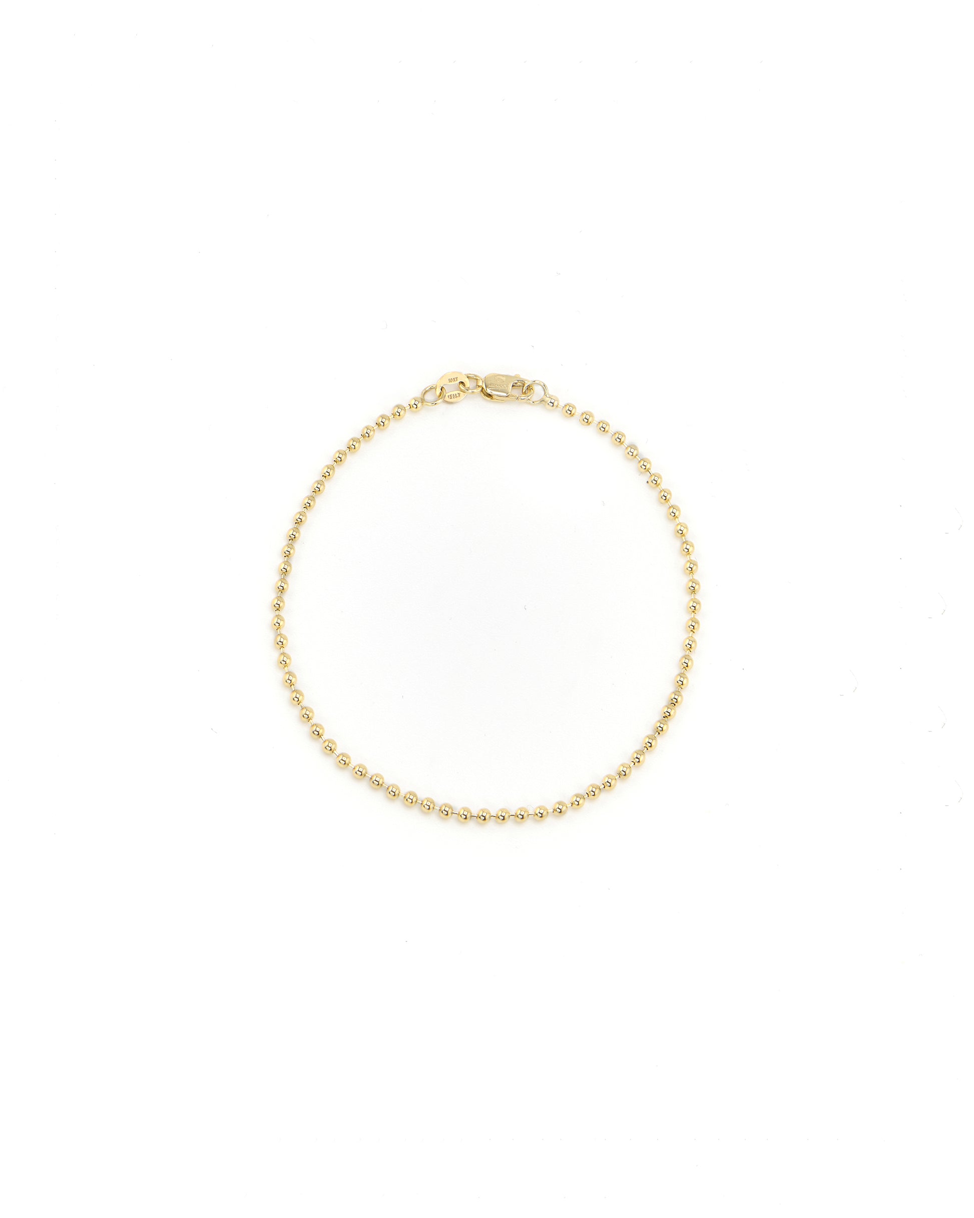 Gold bracelet on a white background