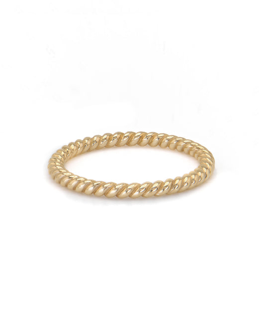 A single gold rope stacker ring with a twisted design, displayed against a white background
