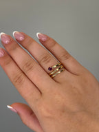 Ruby spiral wrap ring worn on hand, close-up