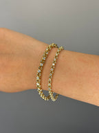 Orbit tennis bracelet worn on wrist, close-up