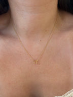 Chai pendant necklace worn on model, close-up
