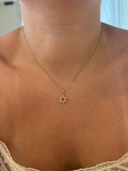 Diamond Star of David pendant worn on model, close-up