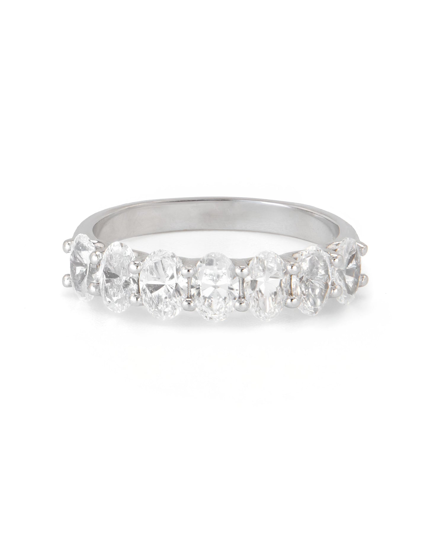 A band ring with multiple oval-shaped diamonds set in a row.