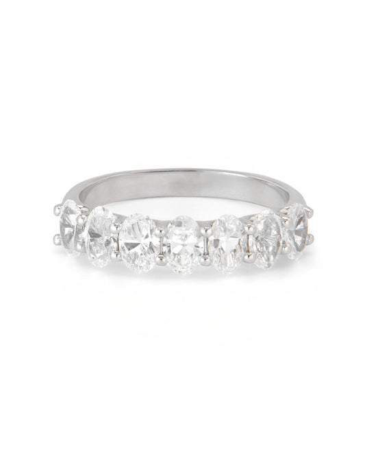 A band ring with multiple oval-shaped diamonds set in a row.