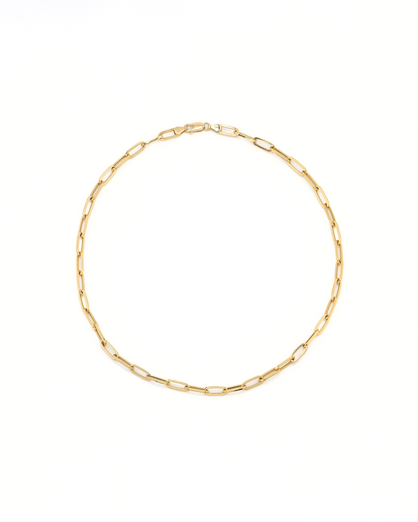 Gold chain necklace on a white background