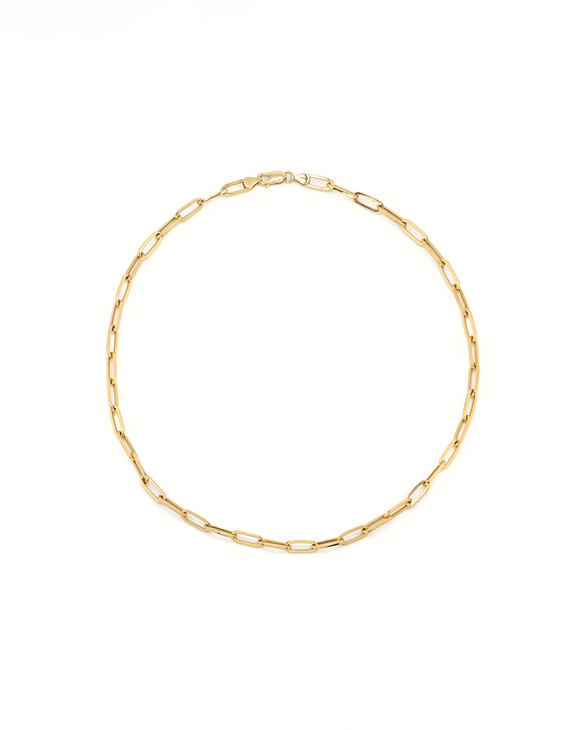 Gold chain necklace on a white background