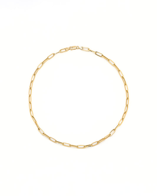 Gold chain necklace on a white background