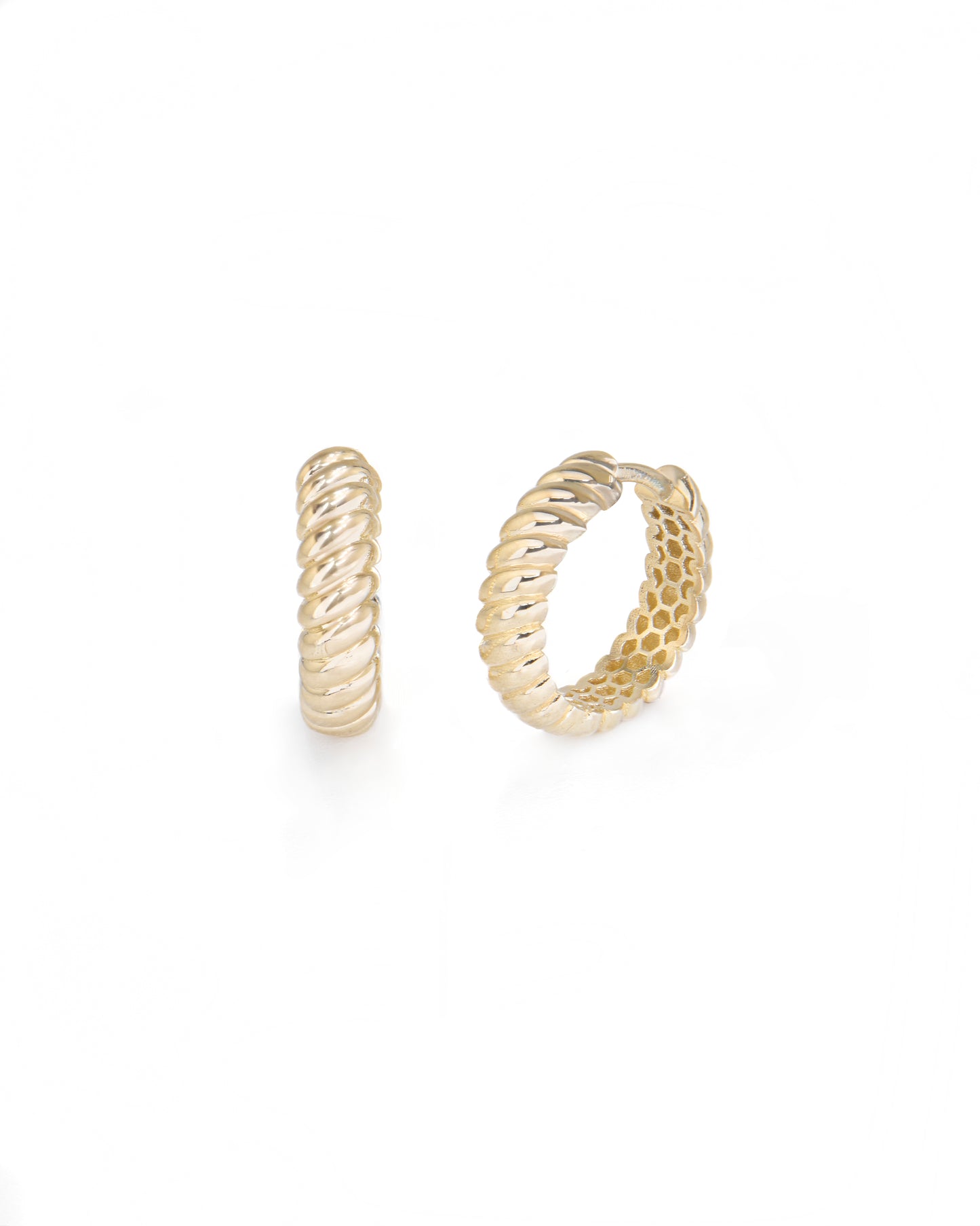 Gold hoop earrings on a white background