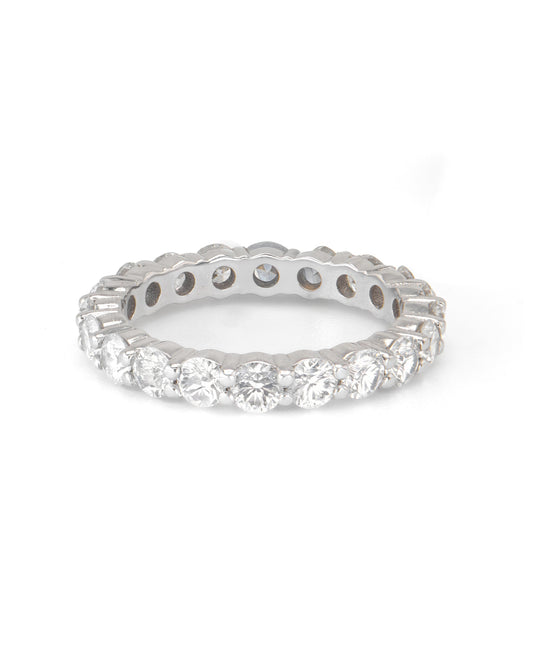 A round diamond shared prong band ring with multiple stones, displayed against a white background.