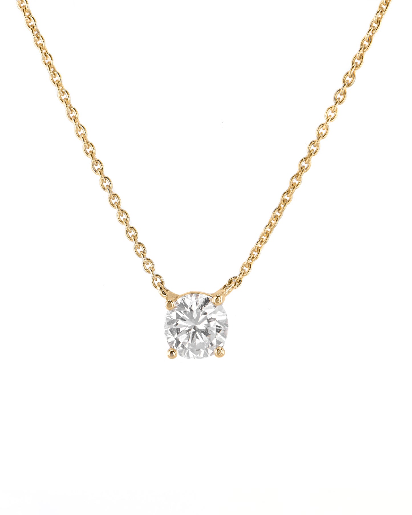 Gold necklace with a diamond pendant on a white background