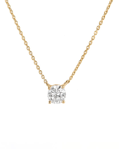 Gold necklace with a diamond pendant on a white background