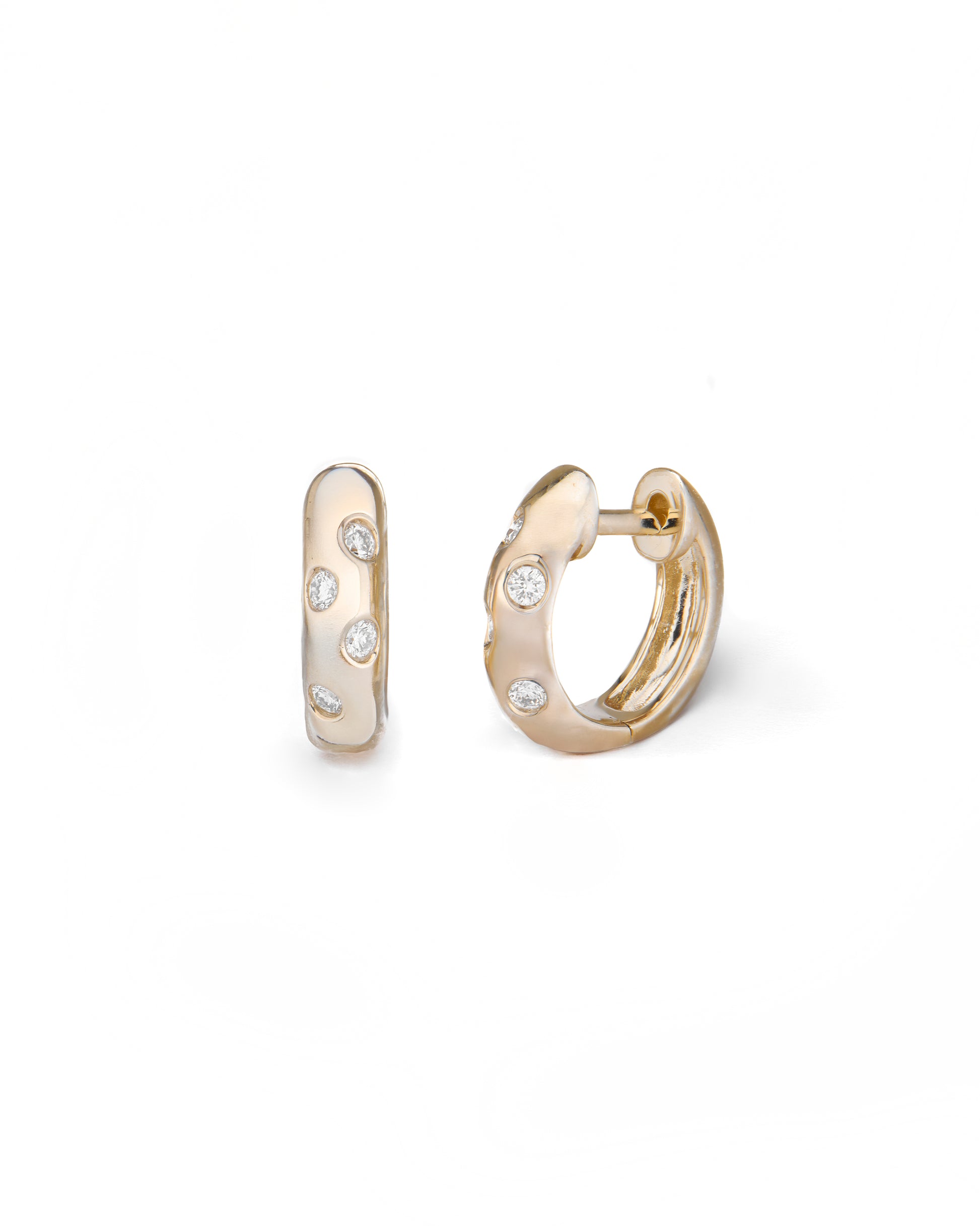 Gold hoop earrings with small diamonds on a white background