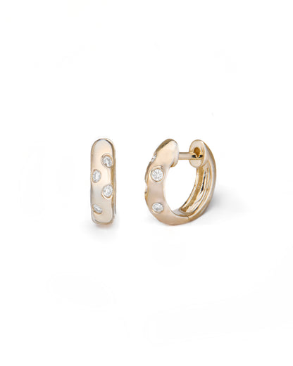 Gold hoop earrings with small diamonds on a white background