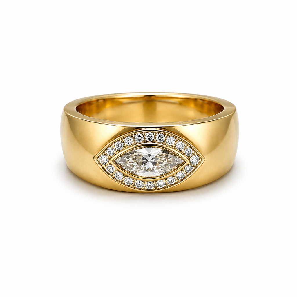 Gold ring with a marquise diamond on a white background