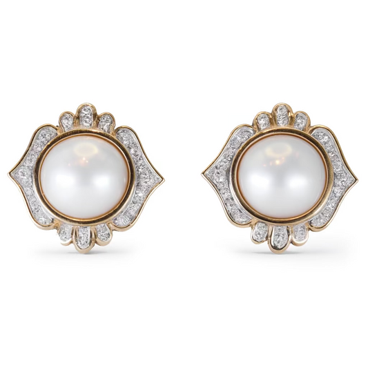 Pair of earrings with pearls and gold accents on a white background