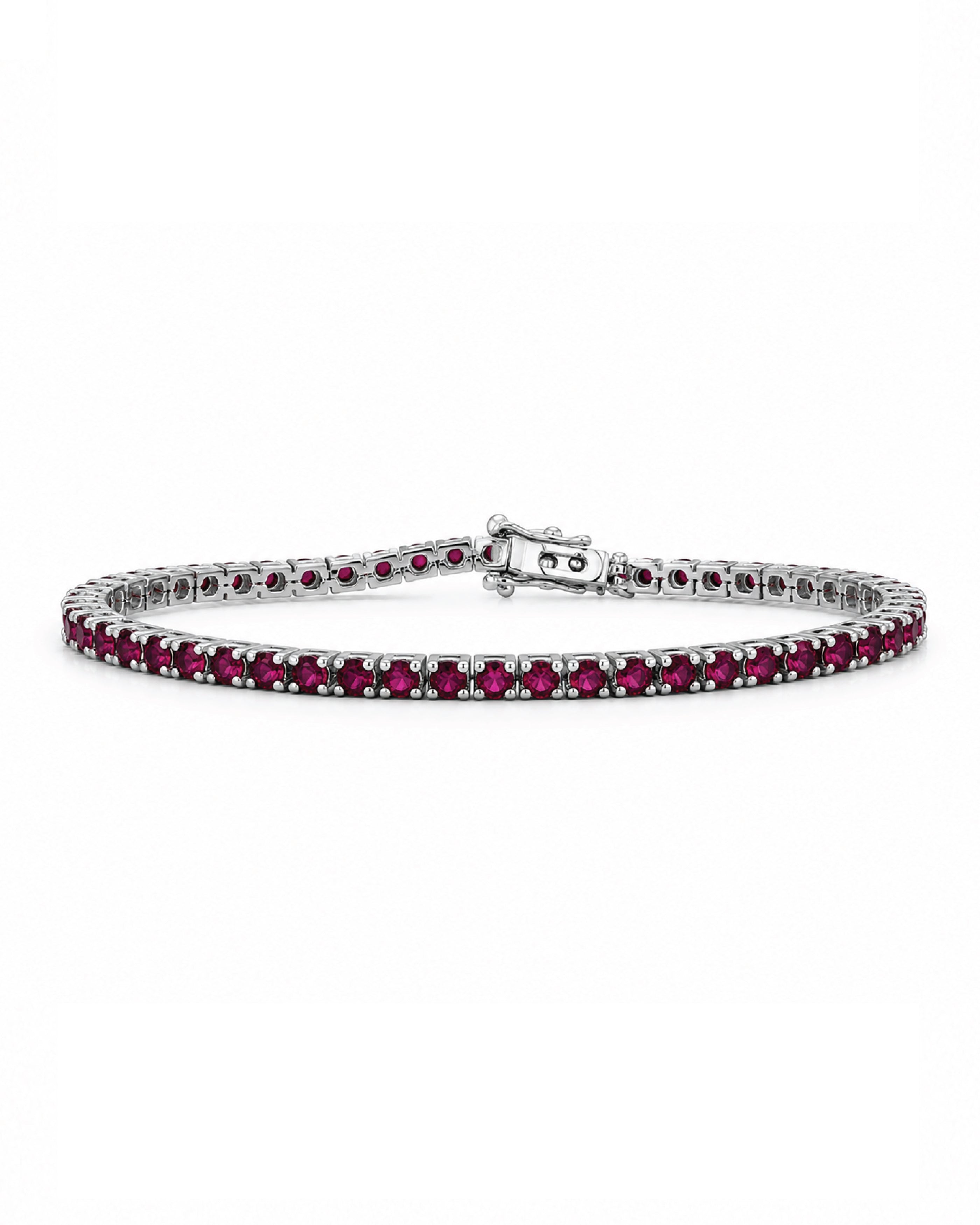 A tennis bracelet featuring round deep red rubies in a white gold setting, displayed on a clean white background.