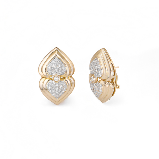 Gold earrings with heart design on a white background